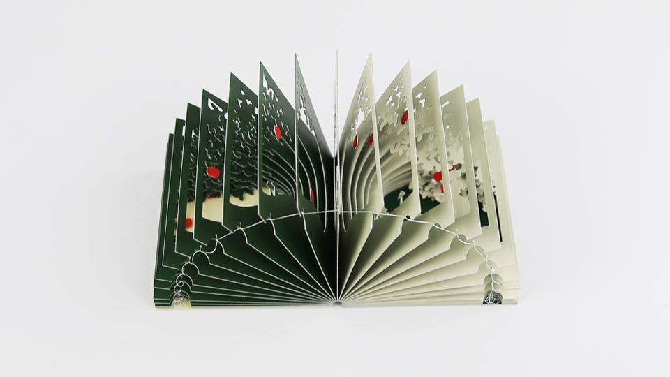 SNOW WHITE 360°BOOK by Yusuke Oono, published by Seigenha Art Publishing in 2016. Carefully crafted paper art book with a 360-degree panoramic scene of layered silhouettes, showing Snow White’s story.