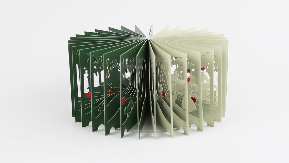 SNOW WHITE 360°BOOK by Yusuke Oono, published by Seigenha Art Publishing in 2016. Carefully crafted paper art book with a 360-degree panoramic scene of layered silhouettes, showing Snow White’s story.