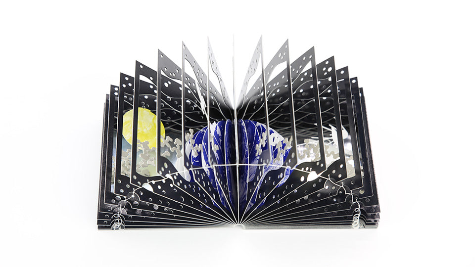 EARTH AND THE MOON 360°BOOK by Yusuke Oono, published by Seigenha Art Publishing. Carefully crafted paper art book with a 360-degree panoramic scene of layered silhouettes.