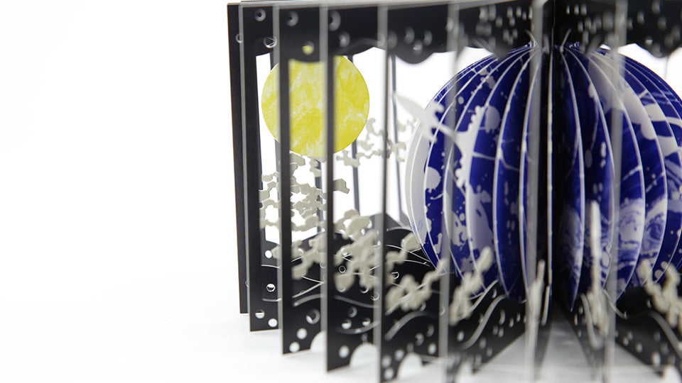 EARTH AND THE MOON 360°BOOK by Yusuke Oono, published by Seigenha Art Publishing. Carefully crafted paper art book with a 360-degree panoramic scene of layered silhouettes.