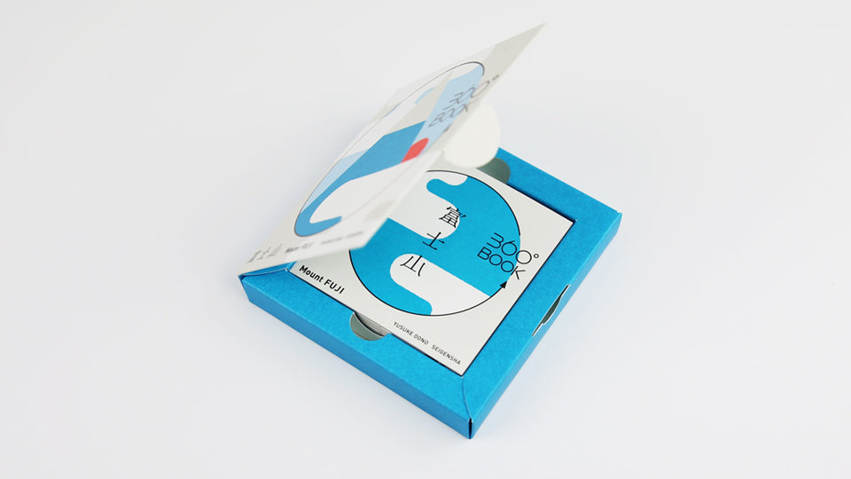 MOUNT FUJI 360°BOOK by Yusuke Oono, published by Seigenha Art Publishing in 2015. Carefully crafted paper art book with a 360-degree panoramic scene of layered silhouettes, showing Mount Fuji.