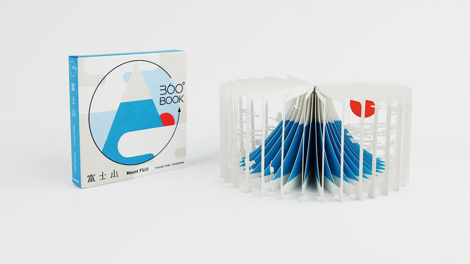 MOUNT FUJI 360°BOOK by Yusuke Oono, published by Seigenha Art Publishing in 2015. Carefully crafted paper art book with a 360-degree panoramic scene of layered silhouettes, showing Mount Fuji.