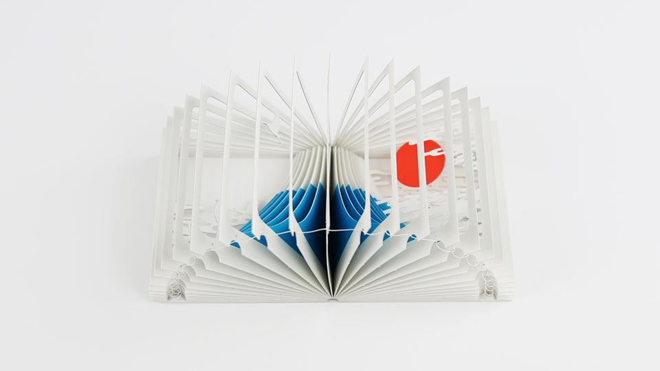 MOUNT FUJI 360°BOOK by Yusuke Oono, published by Seigenha Art Publishing in 2015. Carefully crafted paper art book with a 360-degree panoramic scene of layered silhouettes, showing Mount Fuji.