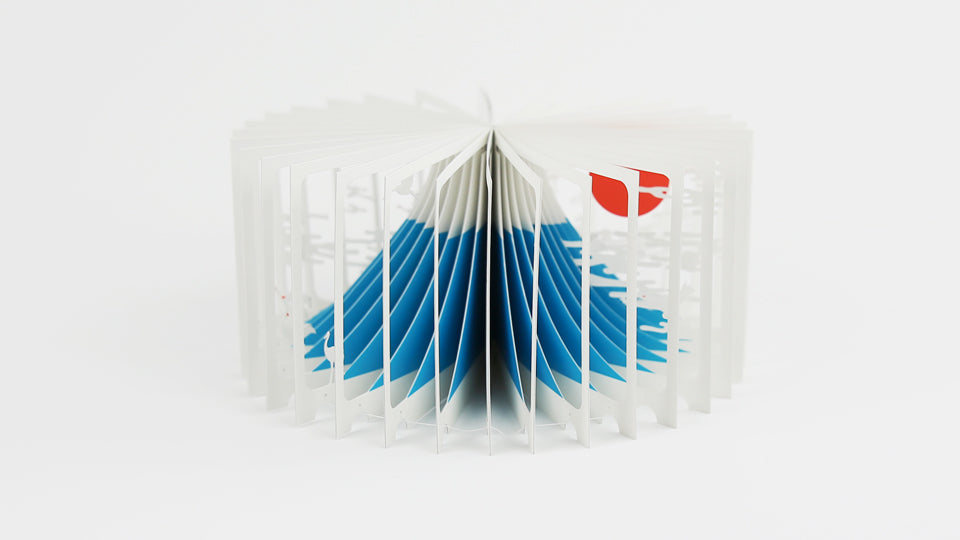 MOUNT FUJI 360°BOOK by Yusuke Oono, published by Seigenha Art Publishing in 2015. Carefully crafted paper art book with a 360-degree panoramic scene of layered silhouettes, showing Mount Fuji.