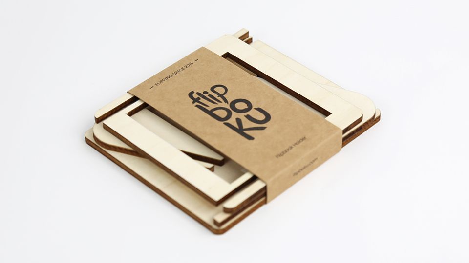 FLIPBOKU HOLDER - a practical tool that will enrich your experience with our interactive flip books Molecularis, Blanko and Dots &amp; Lines. It gives you some more freedom of movement while coloring, drawing, or connecting the dots.